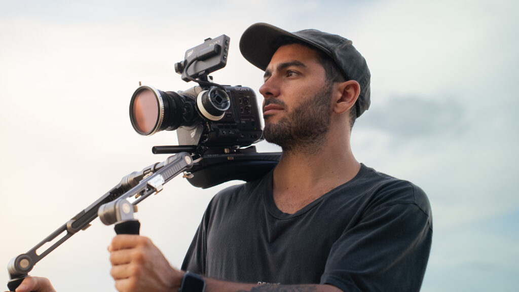 Filmmaker Luca Epifani operating a professional cinema camera during the production of Madara’s documentary
