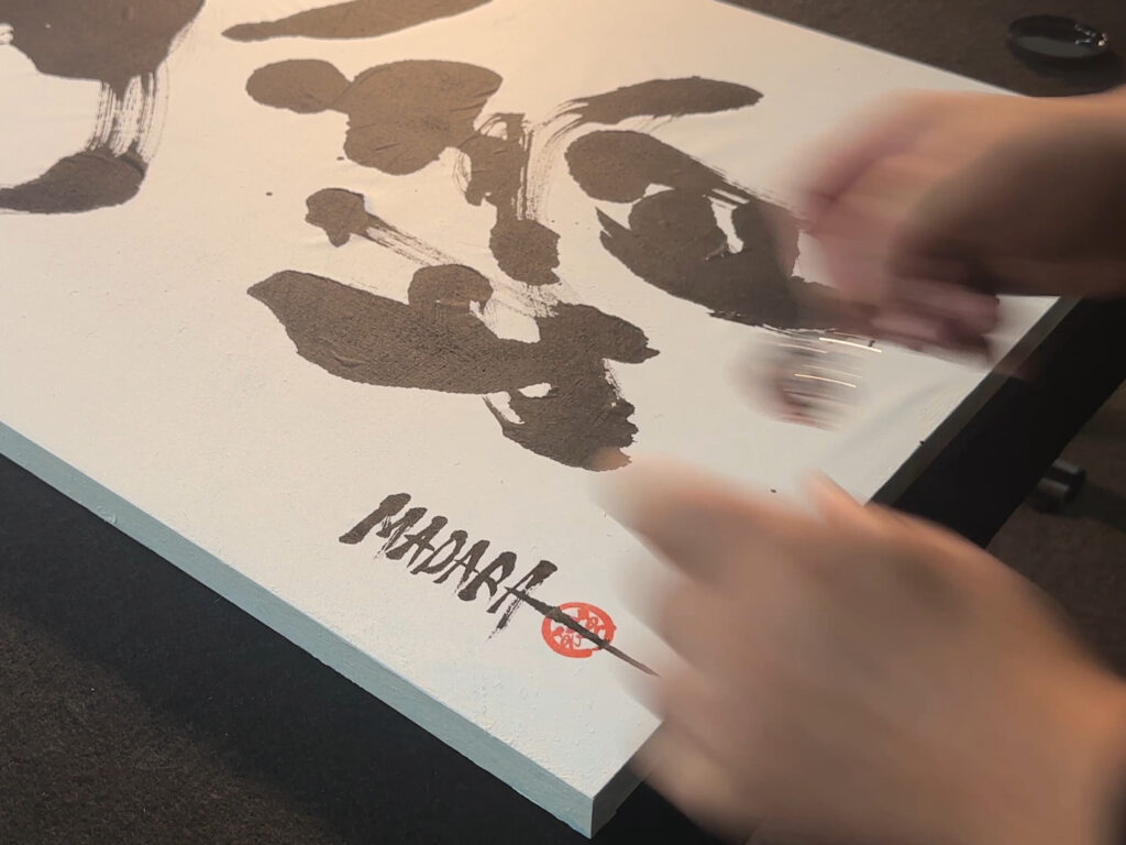 traveler receiving kanji name calligraphy artwork in tokyo hotel